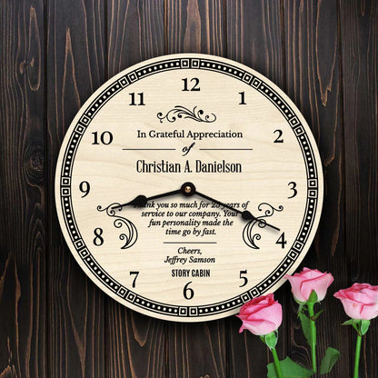 Personalized clock with text on a wooden background with pink roses.